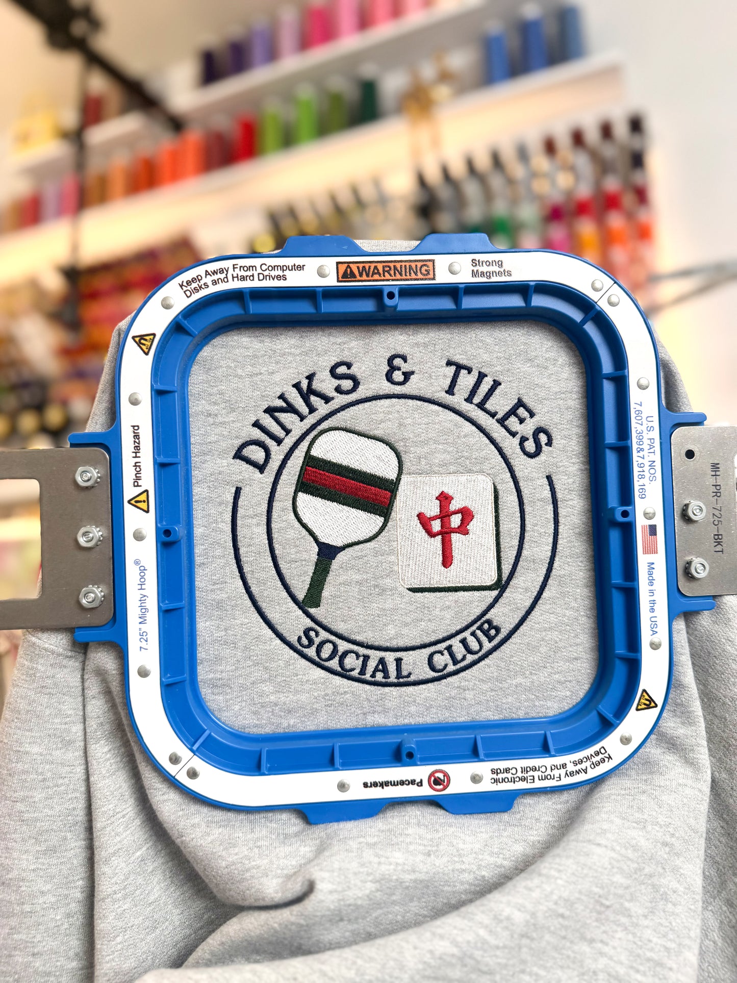 Dinks & Tiles Social Club crewneck sweatshirt featuring pickleball paddle and mahjong tile graphic on center chest